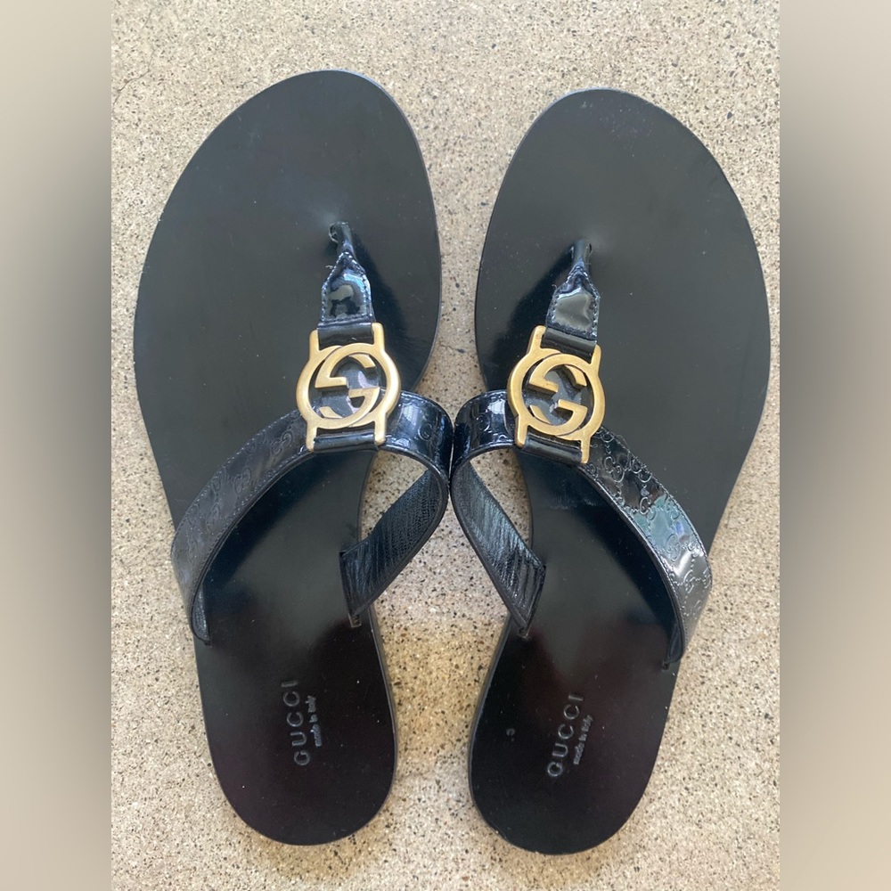 Gucci Genuine Black Leather, T-Strap sandals with gold GG buckle.